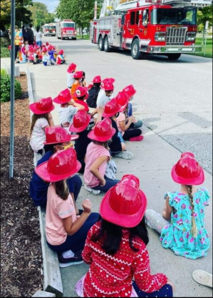 Children watching Fire Trucks 