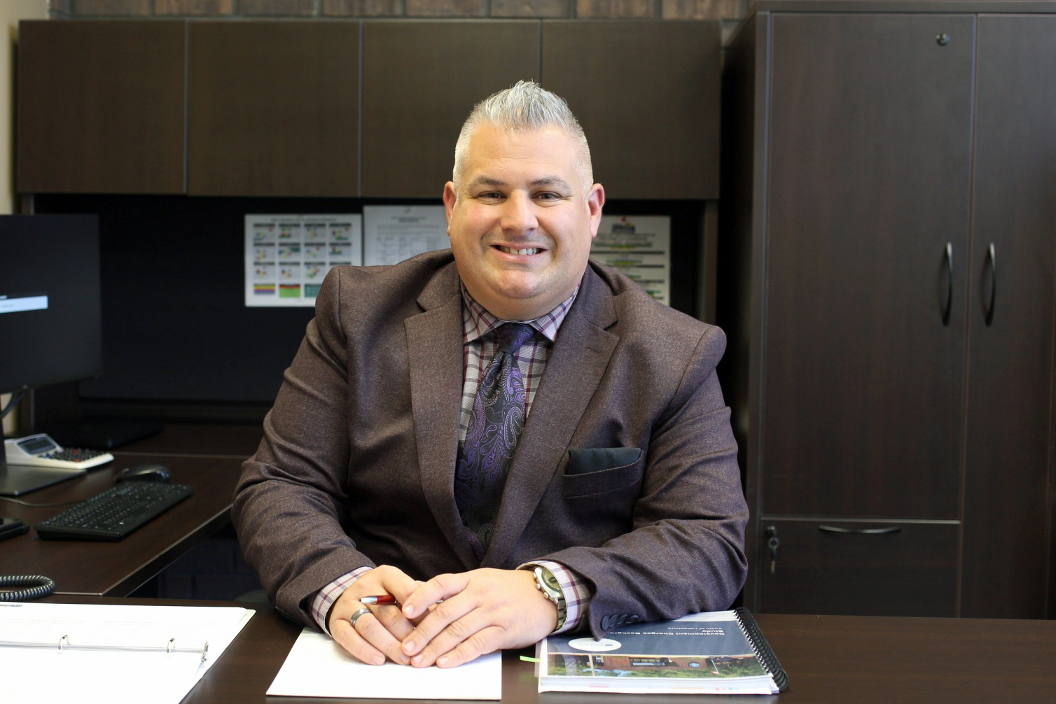 Image of Justin Rousseau sitting at his desk at Lakeshore Town Hall