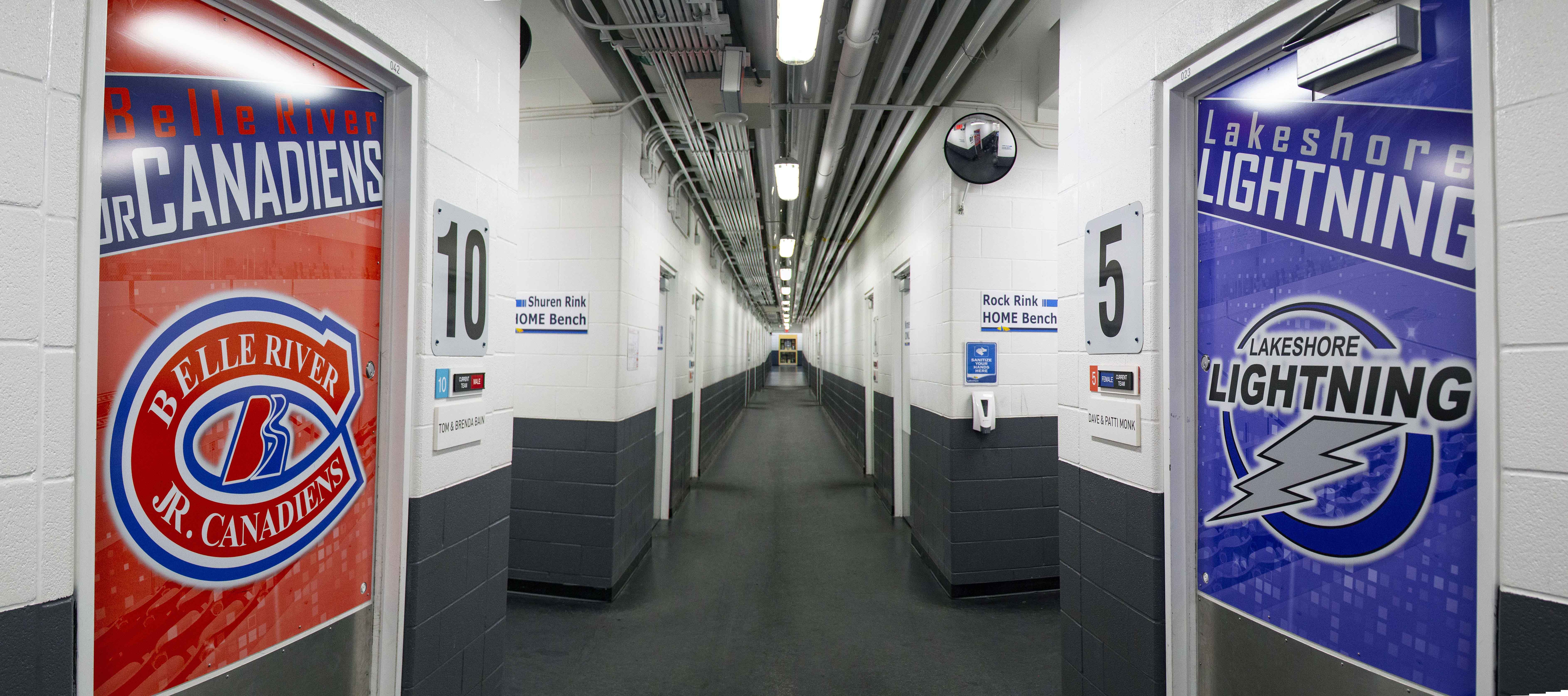 Panoramic image of two newly designed locker rooms doors featuring Belle River Jr. Canadiens and Lakeshore Lightning branding.