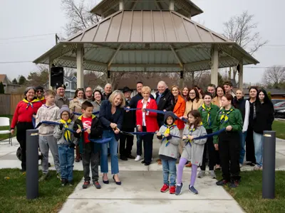 Group photo of ribbon cutting at Linda McKinlay Square