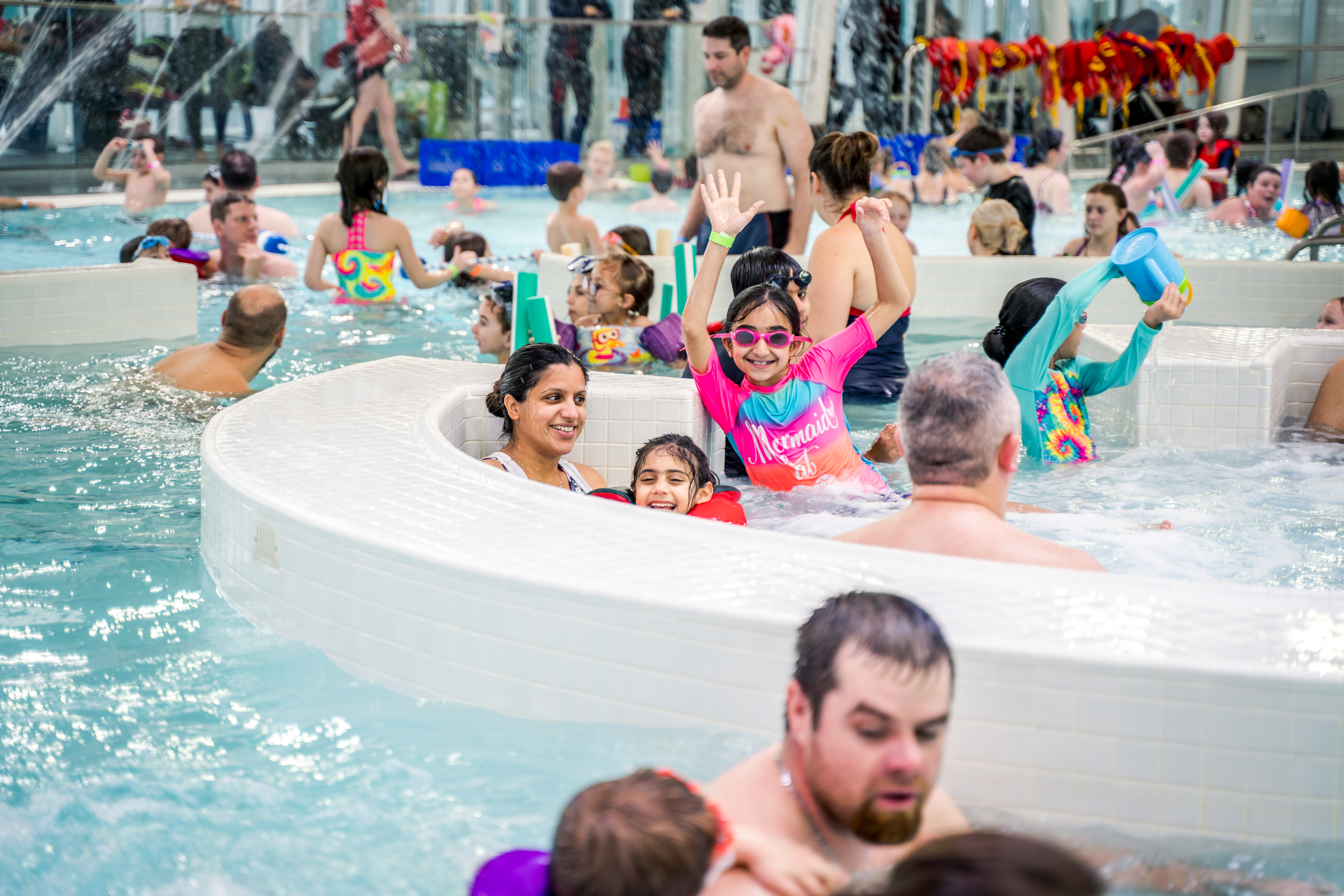 Swimming event with a pool full of people.