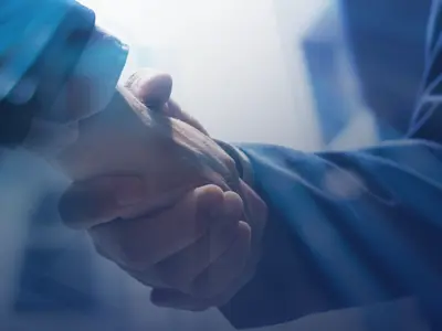 Two people shaking hands.