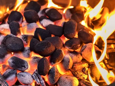 Lit charcoal glowing orange.